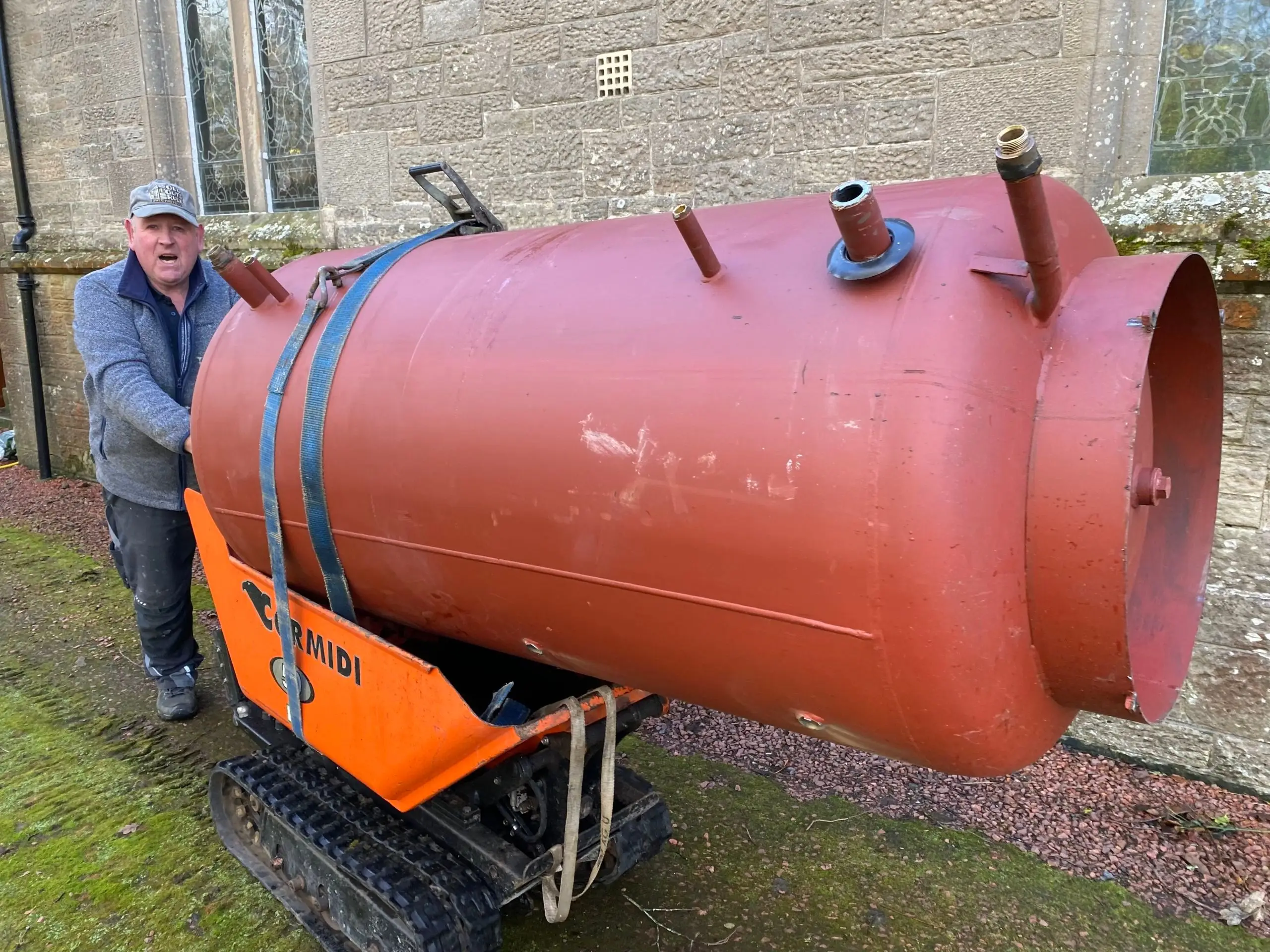 Pulling out old buffer tanks along with an old log boiler