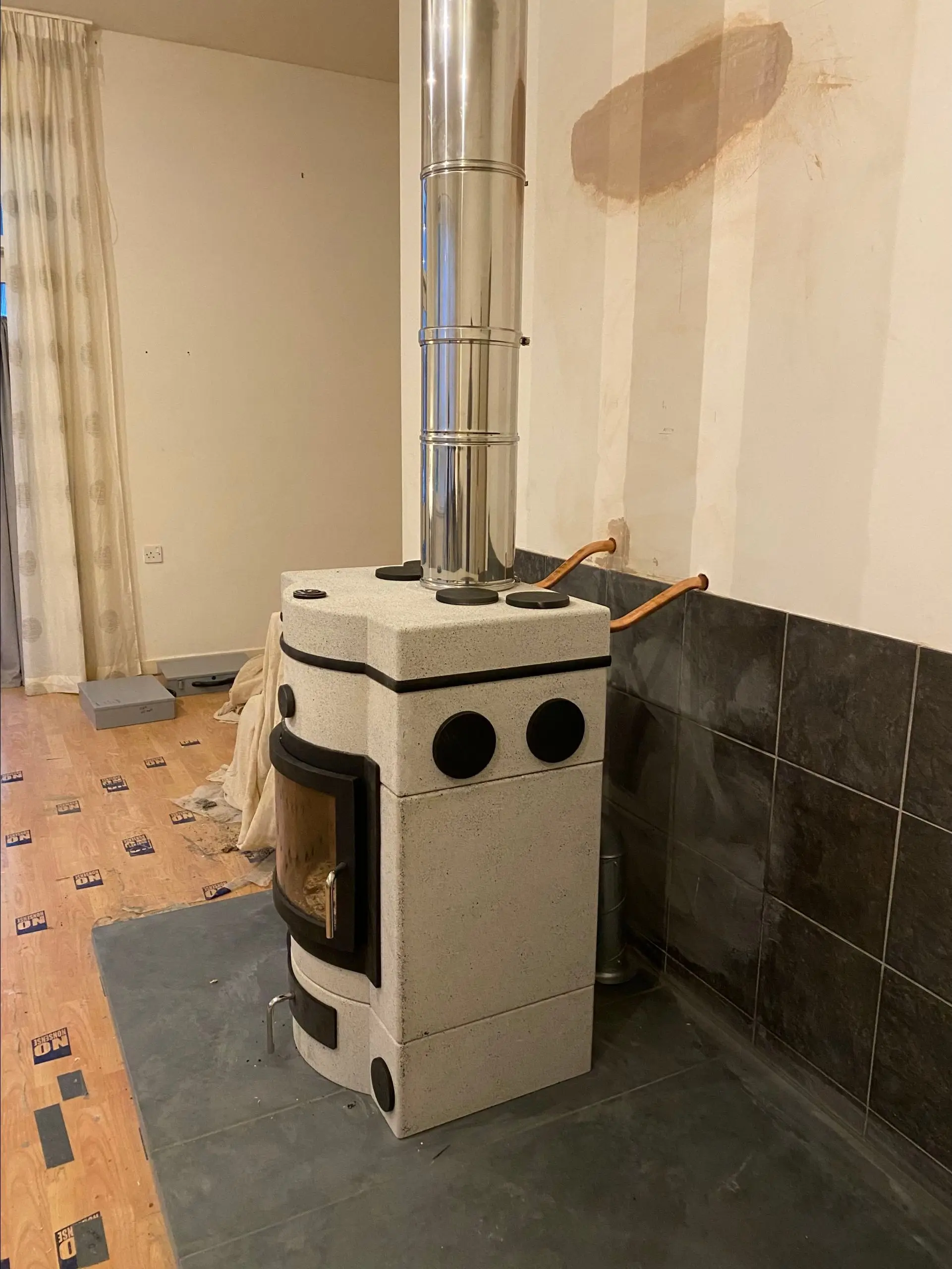An E678 with our custom copper boiler, heating a radiator in the kitchen