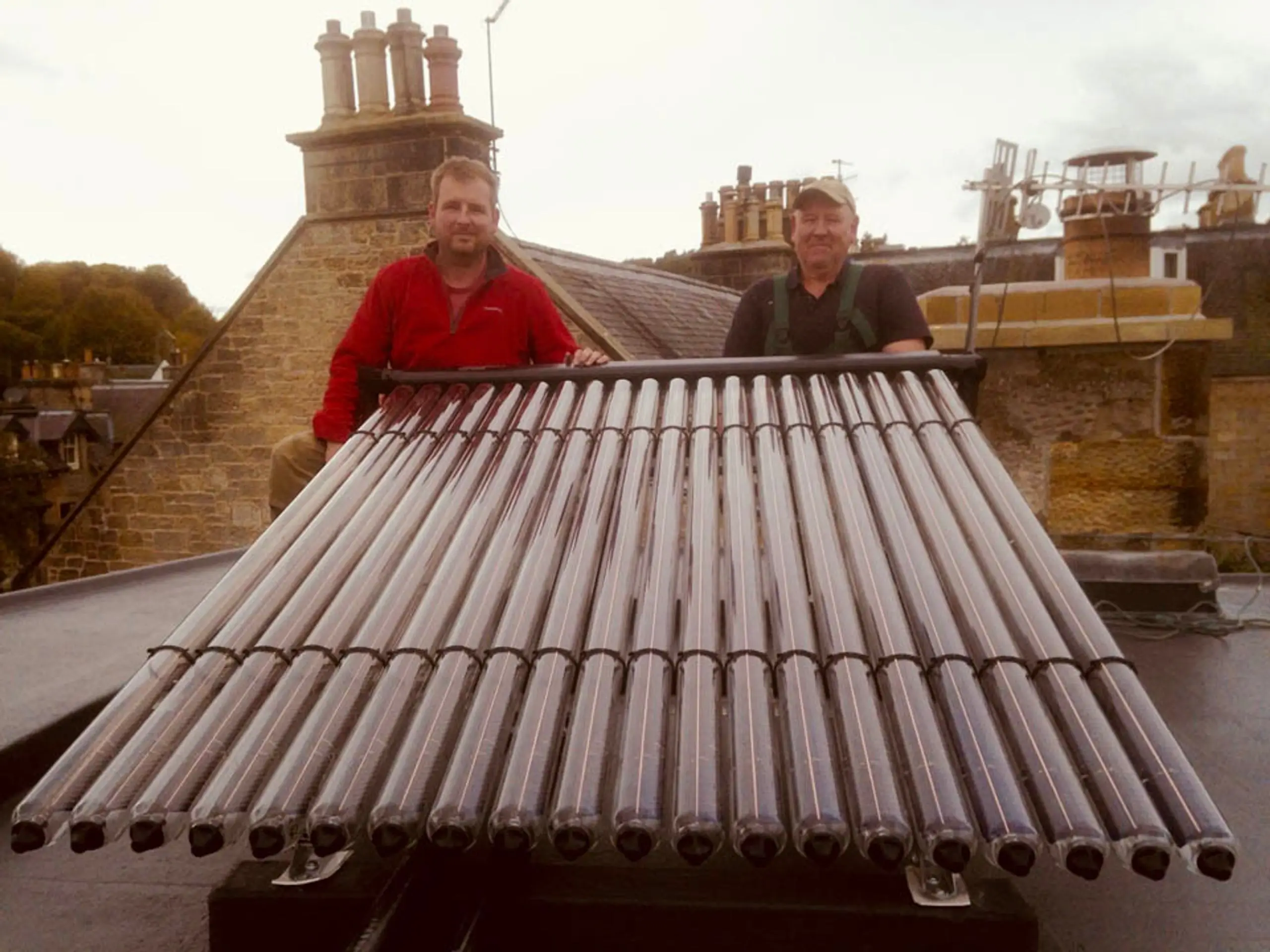 Lifting the evacuated tube collector onto the roof