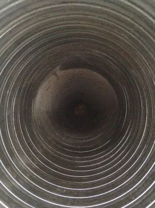 Looking down the inside of a flexible stainless steel chimney liner
